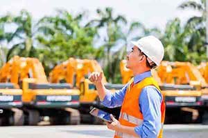 Manager uses equipment rental software to check on site machines. 